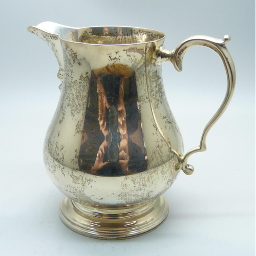 764 - A silver cream jug, Birmingham 1932, Adie Bros., 143g