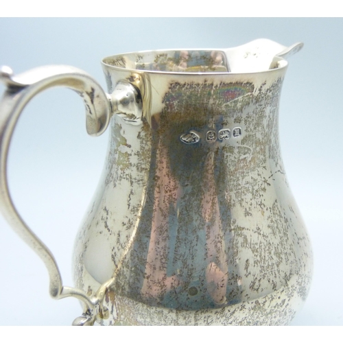 764 - A silver cream jug, Birmingham 1932, Adie Bros., 143g