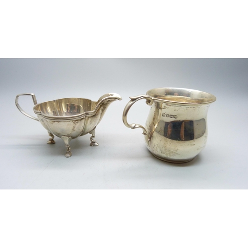 773 - A silver jug and a small silver mug, 133g, mug with initials and dented