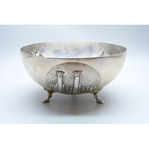 782 - An 830 silver bowl on three feet and with three circular panels with double headed eagle, Corinthian... 