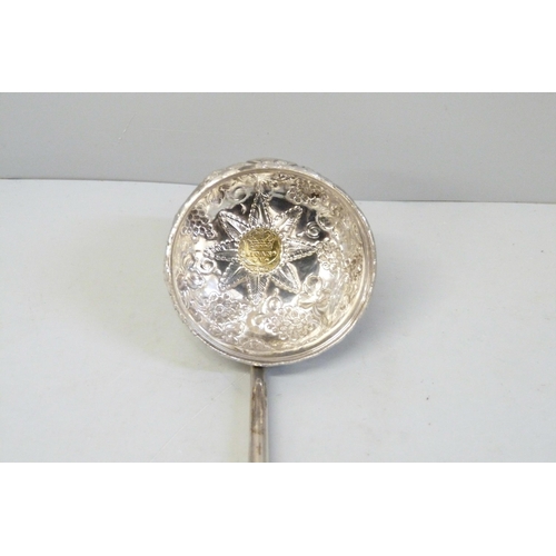 791 - A toddy ladle with baleen handle, the bowl inset with a 1720's Brazilian 400 reis gold coin