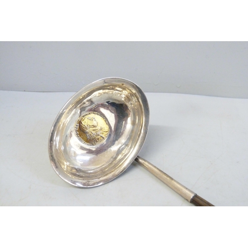 793 - A Georgian toddy ladle inset with a George III 1787 silver coin