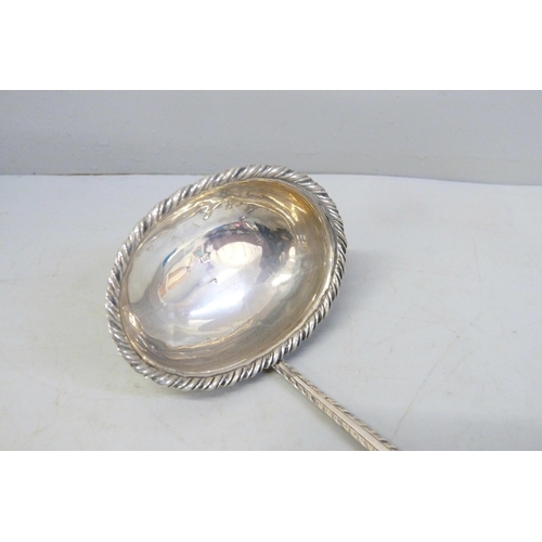 794 - A Georgian silver toddy ladle, worn London hallmark