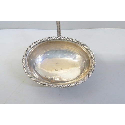 794 - A Georgian silver toddy ladle, worn London hallmark