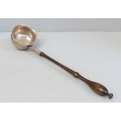 795 - A Georgian silver toddy ladle with worn London hallmark and later handle