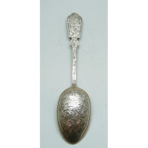 814 - A Victorian silver spoon by Hilliard & Thomason, Birmingham 1891, both sides decorated, 33g, 16.5cm