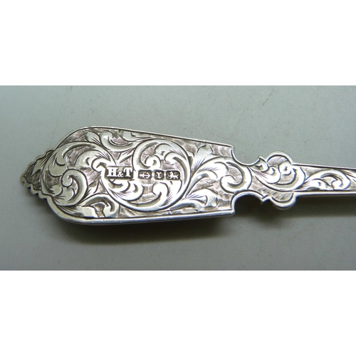 814 - A Victorian silver spoon by Hilliard & Thomason, Birmingham 1891, both sides decorated, 33g, 16.5cm