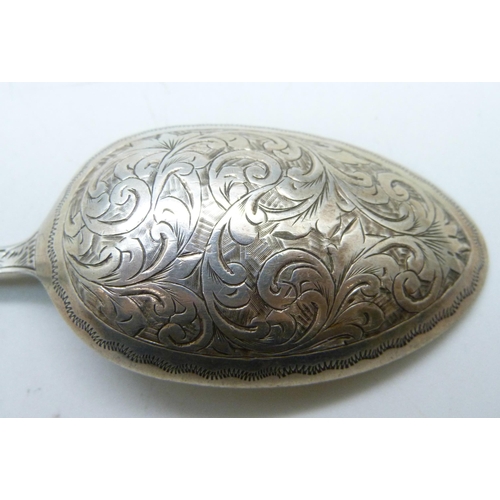 814 - A Victorian silver spoon by Hilliard & Thomason, Birmingham 1891, both sides decorated, 33g, 16.5cm