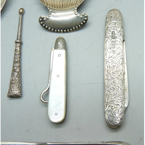 819 - A pair of Russian silver olive nips, two silver caddy spoons including one William IV by Robert Henn... 