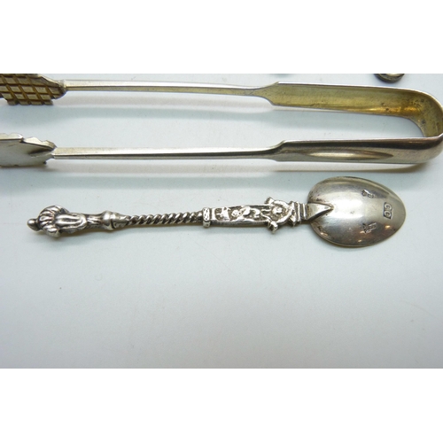 819 - A pair of Russian silver olive nips, two silver caddy spoons including one William IV by Robert Henn... 