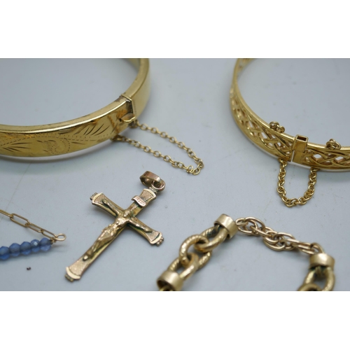 856 - Two rolled gold bangles and a collection of gold plated jewellery including a cross pendant and brac... 