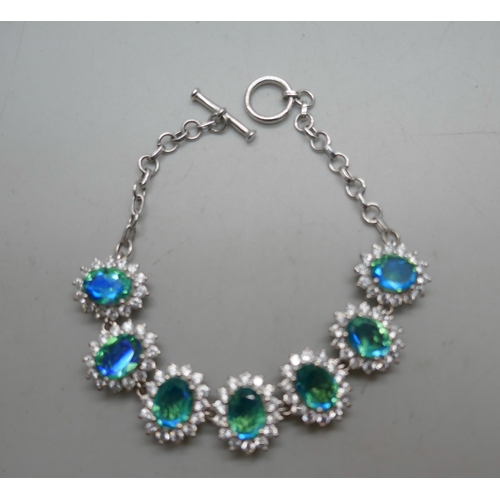 861 - A silver bracelet set with blue/green and white stone clusters, 19.5cm, 17g