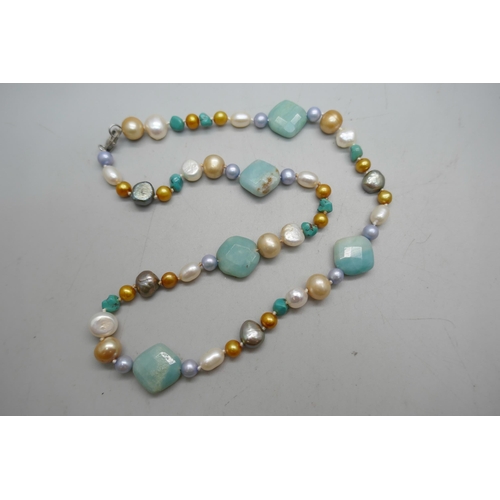 864 - A pearl and gemstone necklace with silver clasp