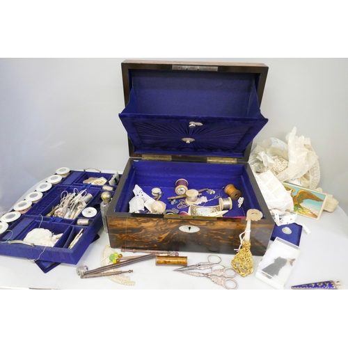 868 - A coromandel sewing box with a large collection of sewing related items, mother of pearl cotton reel... 