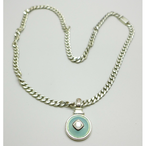 991 - A silver curb link chain necklace with a silver plated pendant, chain 50g