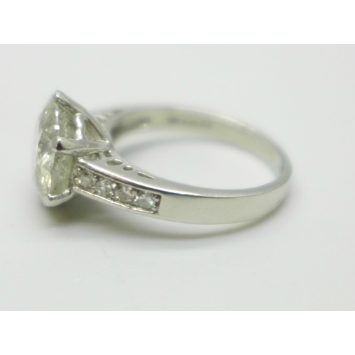 994 - A hallmarked platinum solitaire diamond ring with diamond set shoulders, 3.80cts, 6.2g, M