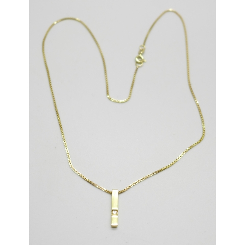 995 - An 18ct gold and diamond pendant on a 9ct gold chain, total weight 3.7g, chain 41cm