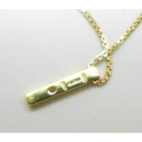 995 - An 18ct gold and diamond pendant on a 9ct gold chain, total weight 3.7g, chain 41cm