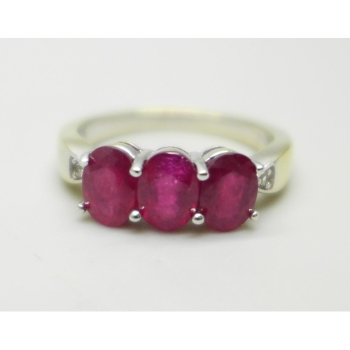 999 - A silver gilt, ruby and white stone ring, S