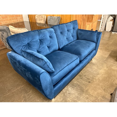 1471 - A blue velvet Hoxton three seater sofa