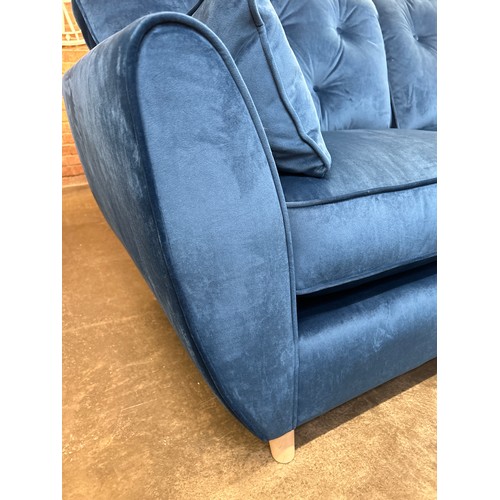 1471 - A blue velvet Hoxton three seater sofa