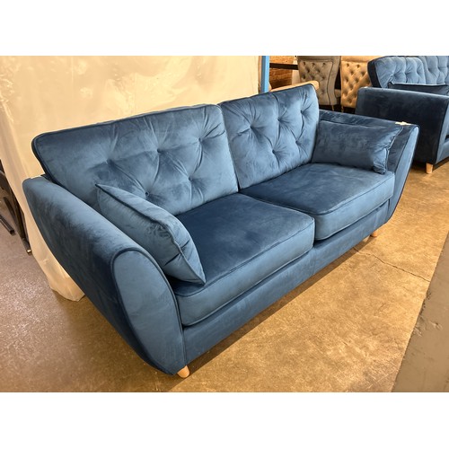 1472 - A blue velvet Hoxton three seater sofa