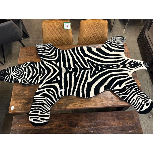 1466 - A 6ft x 4ft rug in the form of a zebra