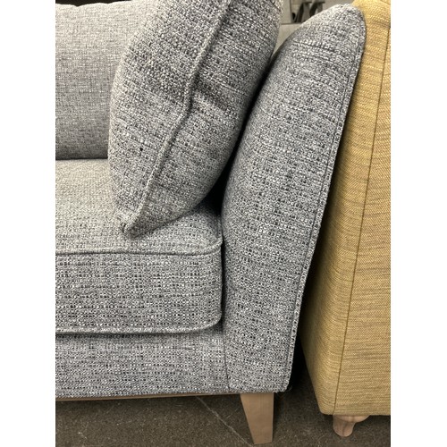 1467 - A grey weave three seater sofa