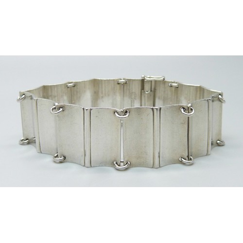 988A - A Georg Jensen silver panel bracelet designed by Arno Malinowski, marked Georg Jensen Sterling Denma... 