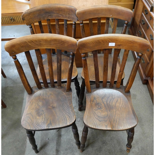 106 - A set of four Victorian elm and beech kitchen chairs