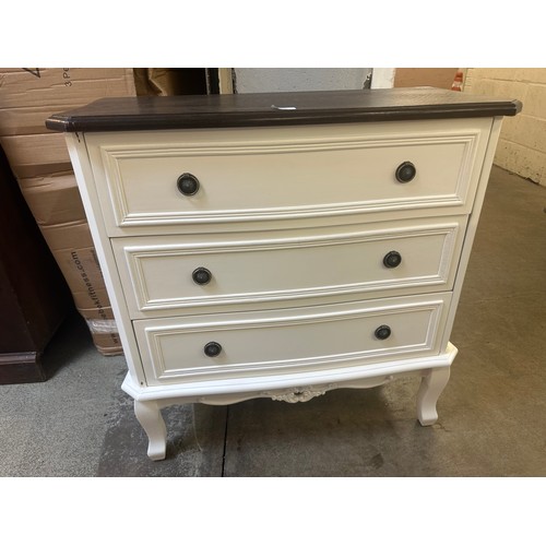 1562 - A white three drawer chest with contrast top