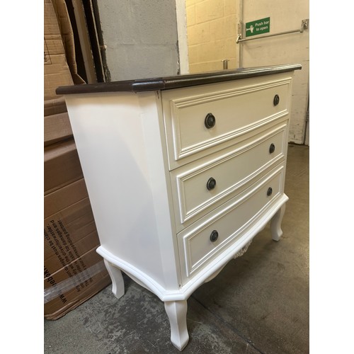 1562 - A white three drawer chest with contrast top