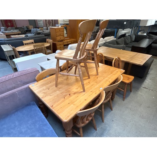 1566 - A pine dining table and six slat back chairs