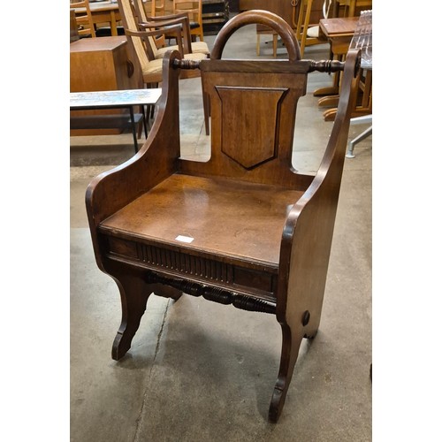 127 - A Victorian Aesthetic Movement walnut hall chair