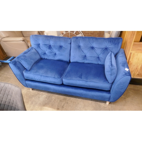 1471 - A blue velvet Hoxton three seater sofa