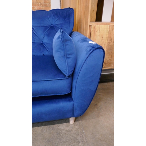 1471 - A blue velvet Hoxton three seater sofa