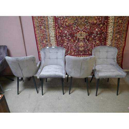 1490 - A set of four grey velvet dining chairs - one damaged *This lot is subject to VAT