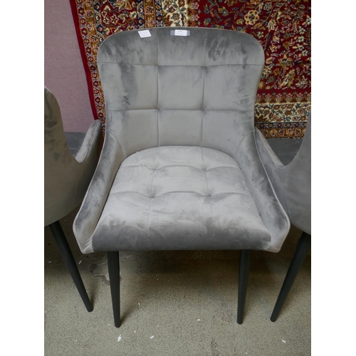 1490 - A set of four grey velvet dining chairs - one damaged *This lot is subject to VAT