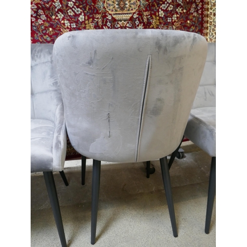 1490 - A set of four grey velvet dining chairs - one damaged *This lot is subject to VAT