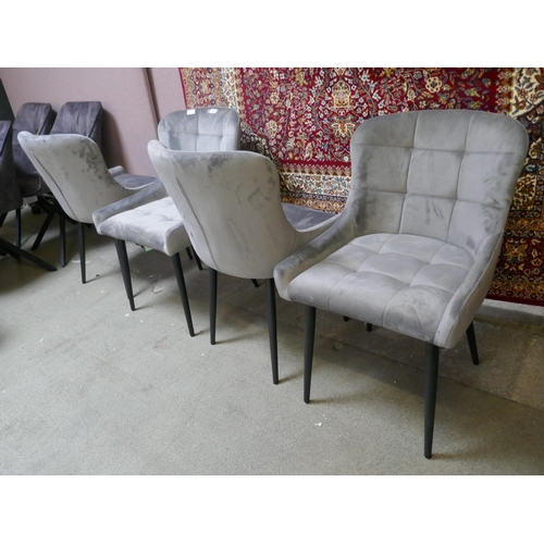 1490 - A set of four grey velvet dining chairs - one damaged *This lot is subject to VAT