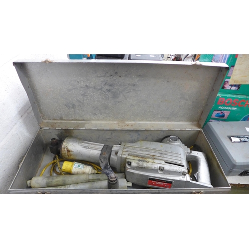 2056 - A Neilsen CT0904 110v 1200w electric hammer chisel with two chisel attachments and metal case