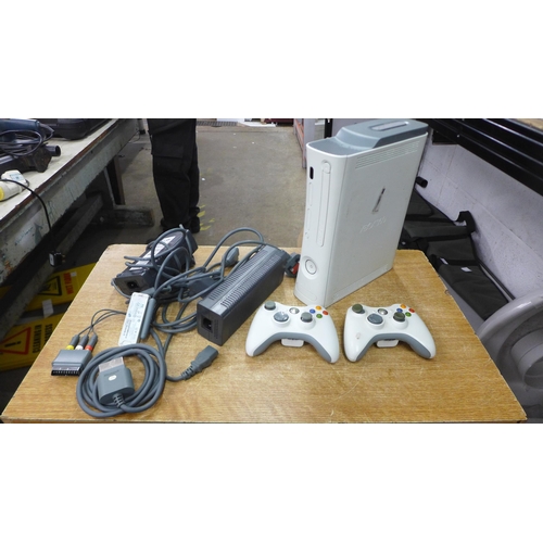 2072 - An Xbox 360 console with a 60gb hard drive, two Xbox 360 controllers and power cable, etc.