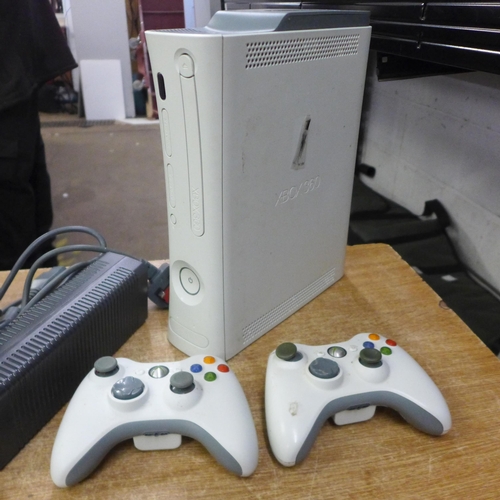 2072 - An Xbox 360 console with a 60gb hard drive, two Xbox 360 controllers and power cable, etc.