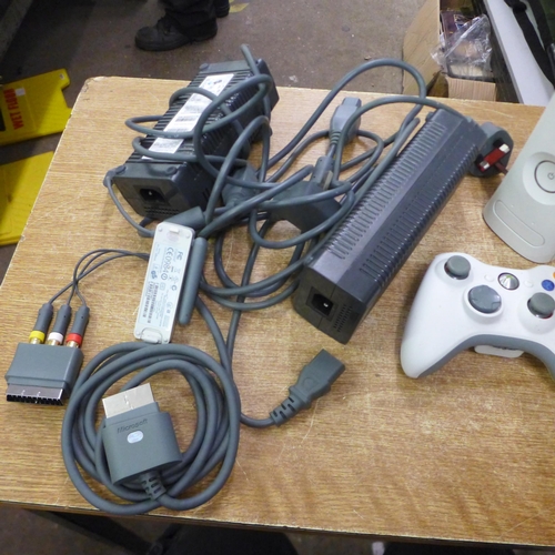 2072 - An Xbox 360 console with a 60gb hard drive, two Xbox 360 controllers and power cable, etc.