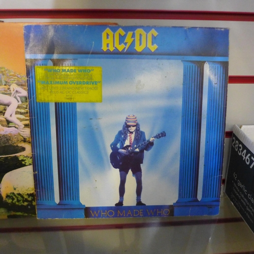 2094 - A box of approximately 30-40 tapes including mostly Rock and 3 LPs; AC-DC Who Made Who, Rolling Ston... 