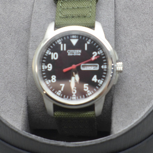 2106 - A men's Citizen Eco-Drive Army style analogue wristwatch with green canvas strap * this lot is subje... 