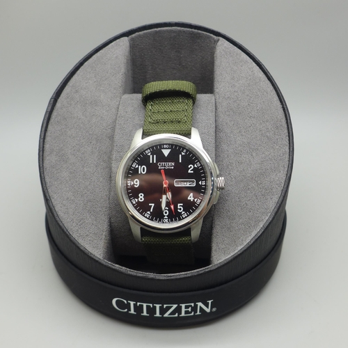 2106 - A men's Citizen Eco-Drive Army style analogue wristwatch with green canvas strap * this lot is subje... 