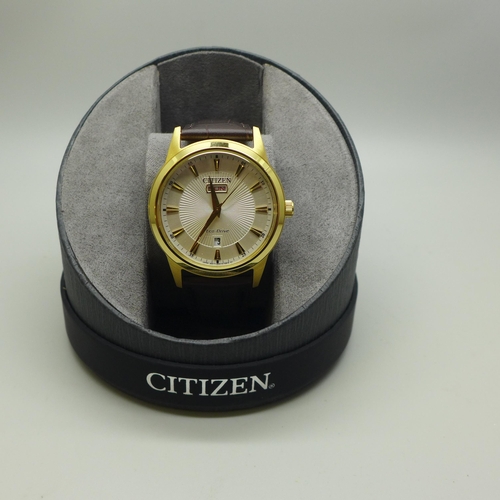 2109 - A men's Citizen Eco-Drive day date wristwatch with a brown leather strap * this lot is subject to VA... 