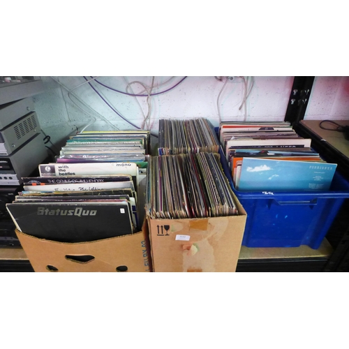 2132 - Four boxes of approx. 600 LPs including mainly rock and pop such as The Beatles, Status Quo, Elvis P... 