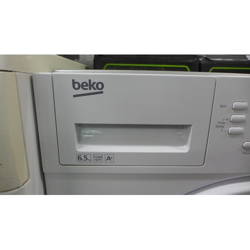 2155 - A Beko (WM161241) 6.5kg 1200 spin integrated washing machine